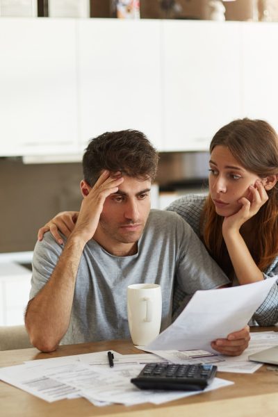young-couple-checking-their-family-budget